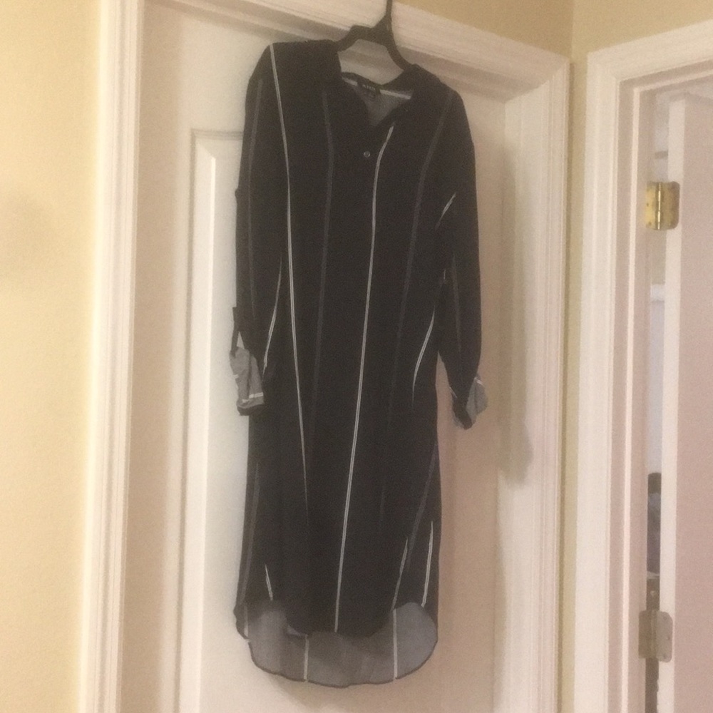 A black and white striped dress with long sleeves